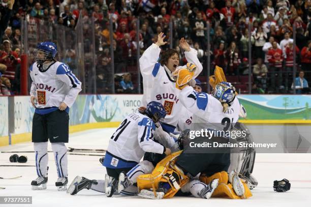 Winter Olympics: Finland goalie Mira Kuisma and Noora Raty victorious after winning Women's Bronze Medal Game - Game 19 vs Sweden at Canada Hockey...