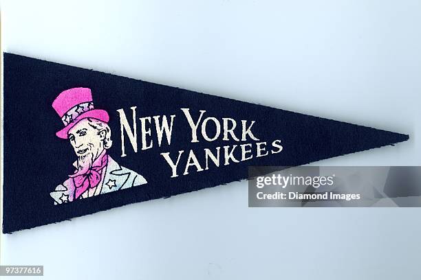 Felt mini pennant for the New York Yankees, including the Uncle Sam mascot that was sold circa-1950 at Yankee Stadium in New York, New York. The...