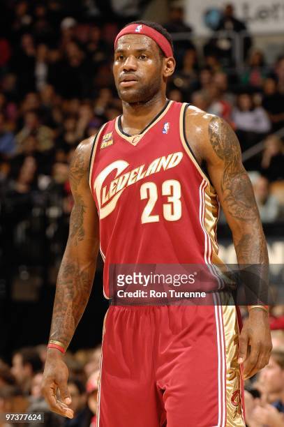 LeBron James of the Cleveland Cavaliers stands on the court during the game against the Toronto Raptors on February 26, 2010 at Air Canada Centre in...