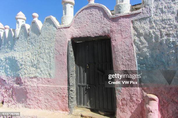 The old painted walls of Harar remind me of the Flintones.