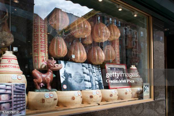 Auricchio Provolone Cheese in Di Palo's Italian Food Shop Window in Little Italy in New York City, USA.