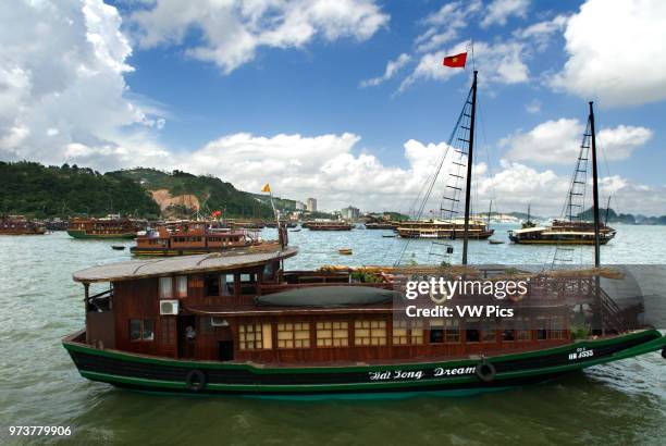 Chinese Junk, Halong Bay Tourist Boat Tour, Vietnam. Junk, boat sailing amongst karst limestone mountains at Cat Ba National Park, Ha long,Halong...