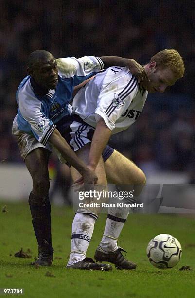 Gary Doherty of Spurs challenges Shaun Goater of Man City during the FA Carling Premiership match between Manchester City v Tottenham Hotspur at...