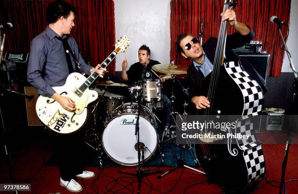 Chris Cheney, Andy Strachan and Scott Owen of The Living End pose on November 19, 2003 in Melbourne, Australia.