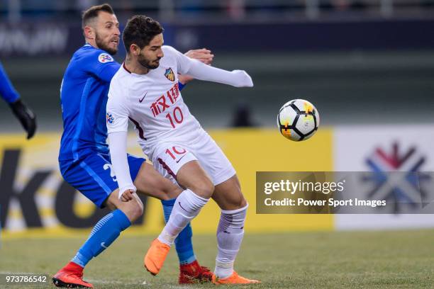 Tianjin Midfielder Alexandre Pato fights for the ball with Kitchee Defender Fernando Recio during the AFC Champions League 2018 round 1 of Group...