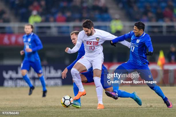 Tianjin Midfielder Alexandre Pato plays against Krisztian Vadocz and Paulinho Carreiro of Kitchee during the AFC Champions League 2018 round 1 of...