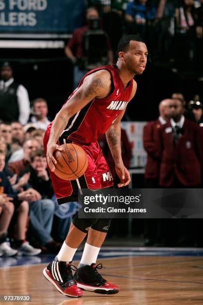 Daequan Cook of the Miami Heat moves the ball against the Dallas Mavericks during the game at the American Airlines Center on February 20, 2010 in...