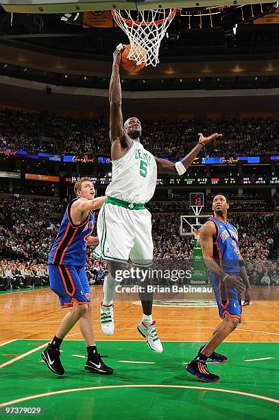 Kevin Garnett of the Boston Celtics goes to the basket as David Lee and Tracy McGrady of the New York Knicks look on during the game on February 23,...