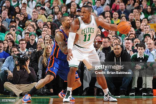 Glen Davis of the Boston Celtics posts up against Wilson Chandler of the New York Knicks during the game on February 23, 2010 at TD Banknorth Garden...