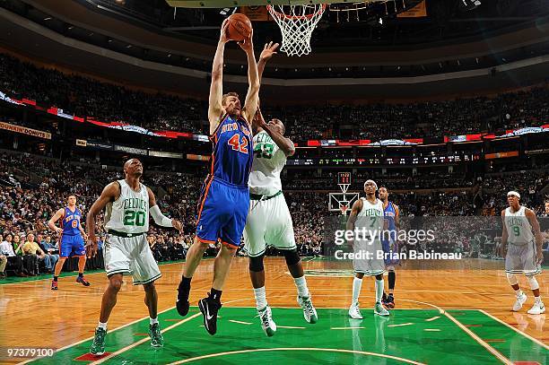 David Lee of the New York Knicks goes to the basket against Kendrick Perkins of the Boston Celtics during the game on February 23, 2010 at TD...