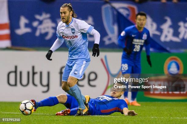 Shanghai Shenhua Midfielder Qin Sheng trips up with Sydney FC Midfielder Joshua Brillante during the AFC Champions League 2018 round 2 of Group H...