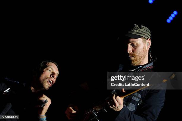 Singer Chris Martin and guitar player Jon Buckland of the group Coldplay perform during their concert at Morumbi Stadium on March 02, 2010 in Sao...