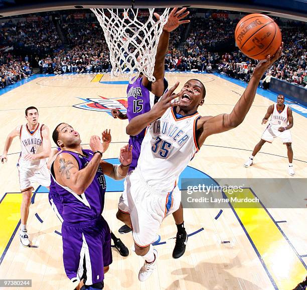 Kevin Durant of the Oklahoma City Thunder goes to the basket against Sean May and Joey Dorsey of the Sacramento Kings on March 2, 2010 at the Ford...