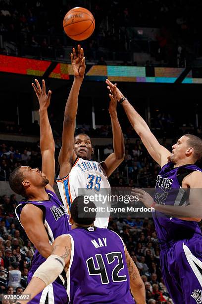 Kevin Durant of the Oklahoma City Thunder shoots over Sean May of the Sacramento Kings on March 2, 2010 at the Ford Center in Oklahoma City,...