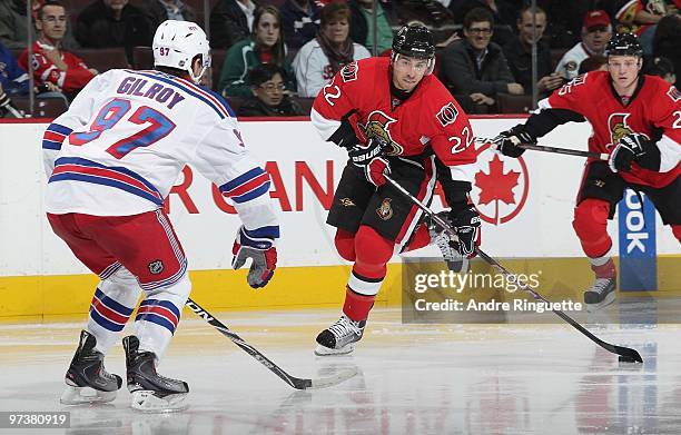 Chris Kelly of the Ottawa Senators winds up for a wristshot against Matt Gilroy of the New York Rangers at Scotiabank Place on March 2, 2010 in...