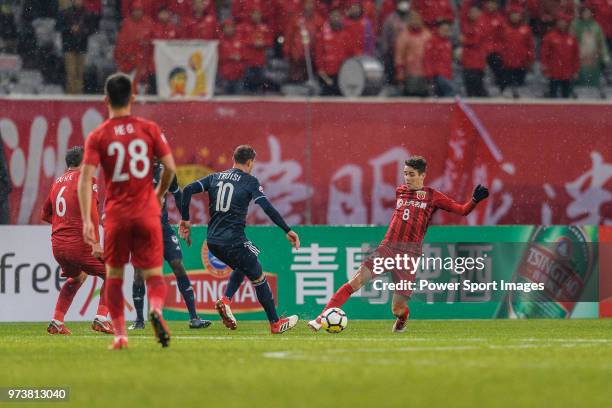 Shanghai FC Forward Oscar Emboaba Junior in action against Melbourne Midfielder James Troisi during the AFC Champions League Group F match between...