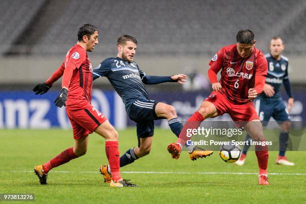 Melbourne Midfielder Terry Antonis in action against Shanghai FC Midfielder Cai Huikang during the AFC Champions League Group F match between...