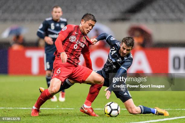 Melbourne Midfielder Terry Antonis in action against Shanghai FC Midfielder Cai Huikang during the AFC Champions League Group F match between...