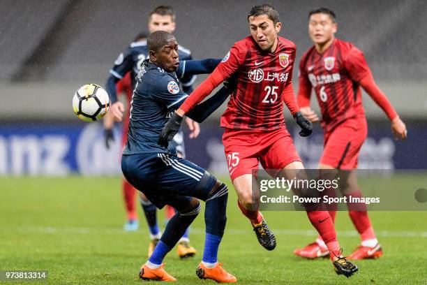 Shanghai FC Midfielder Odil Akhmedov in action against Melbourne Midfielder Leroy George during the AFC Champions League Group F match between...