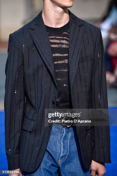 Model, fashion detail, walks the runway at the Roberto Cavalli show during the 94th Pitti Immagine Uomo on June 13, 2018 in Florence, Italy.