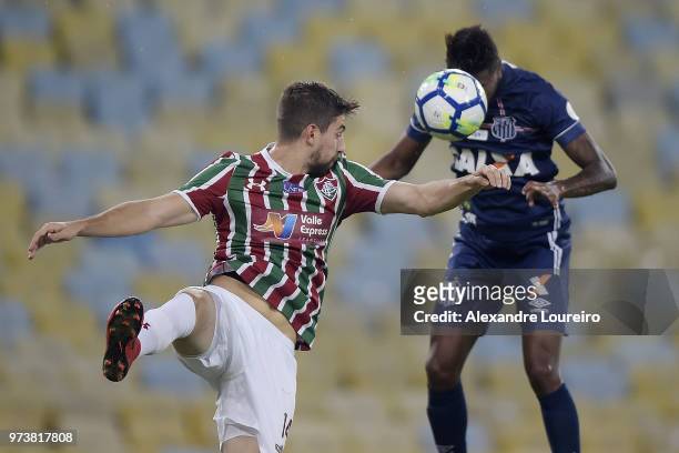 Luan Peres of Fluminense struggles for the ball with Bruno Henriqueof Santos during the match between Fluminense and Santos as part of Brasileirao...