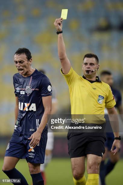 Diego PitucaÂ of Santos recevies a yellow card from referee Rafael Traci during the match between Fluminense and Santos as part of Brasileirao Series...