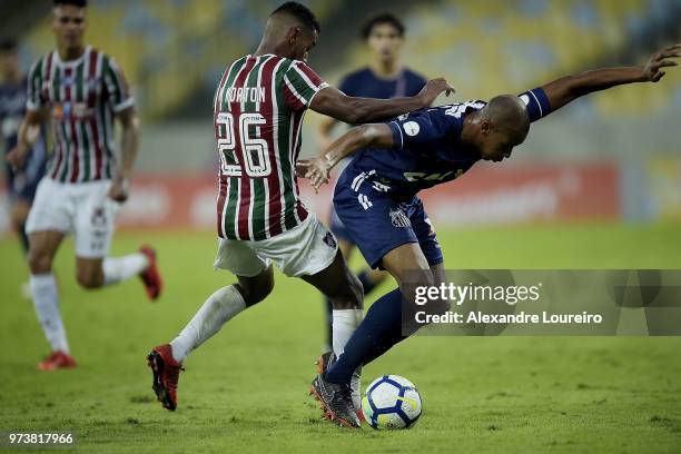 Mateus of Fluminense struggles for the ball with Copete of Santos during the match between Fluminense and Santos as part of Brasileirao Series A 2018...