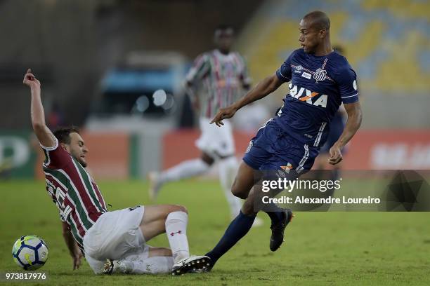 Luan Peres of Fluminense struggles for the ball with Copete of Santos during the match between Fluminense and Santos as part of Brasileirao Series A...