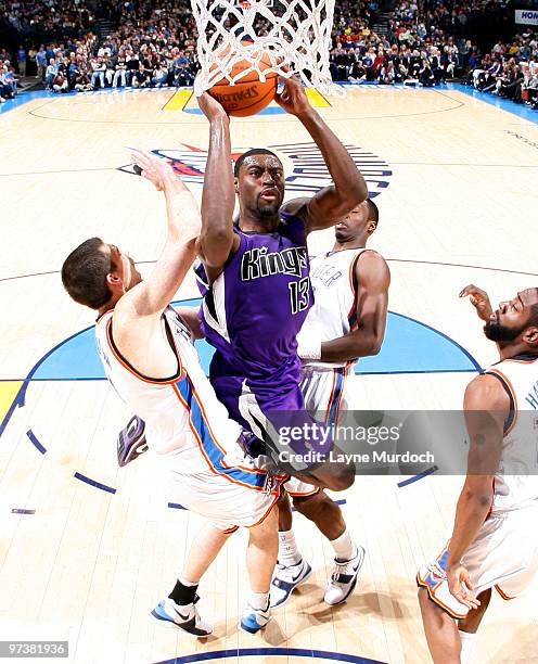 Tyreke Evans of the Sacramento Kings goes to the basket against Nick Collison of the Oklahoma City Thunder on March 2, 2010 at the Ford Center in...