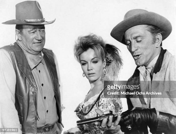 John Wayne, Joanna Barnes and Kirk Douglas on the set of 'The War Wagon' in 1967 in Durango, Mexico.