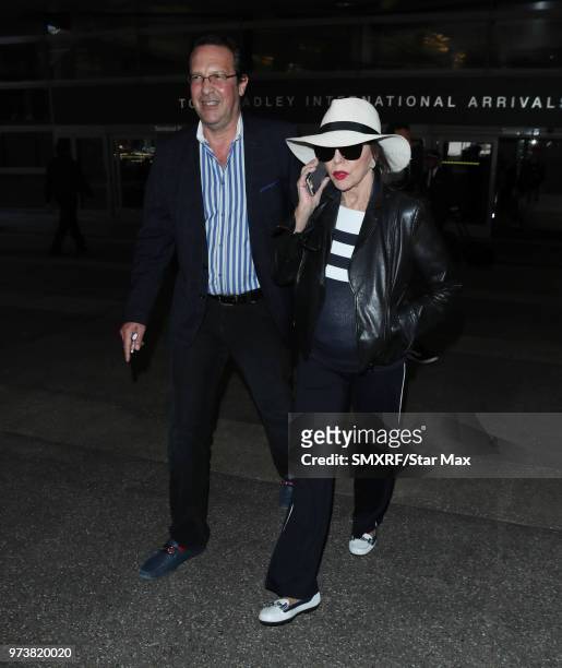 Percy Gibson and Joan Collins are seen on June 13, 2018 in Los Angeles, CA.