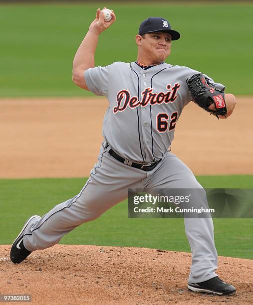 Enrique Gonzalez of the Detroit Tigers pitches against Florida Southern College during a spring training game at Joker Marchant Stadium on March 2,...