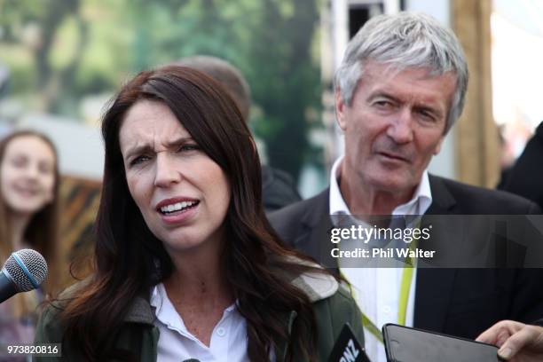 New Zealand Prime Minister Jacinda Ardern speaks as Minister of Agriculture Damien O'Connor looks on during the Mystery Creek Fieldays on June 14,...