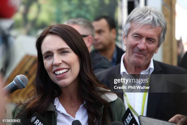 New Zealand Prime Minister Jacinda Ardern speaks as Minister of Agriculture Damien O'Connor looks on during the Mystery Creek Fieldays on June 14,...