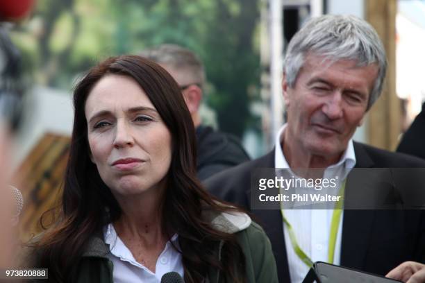 New Zealand Prime Minister Jacinda Ardern speaks as Minister of Agriculture Damien O'Connor looks on during the Mystery Creek Fieldays on June 14,...