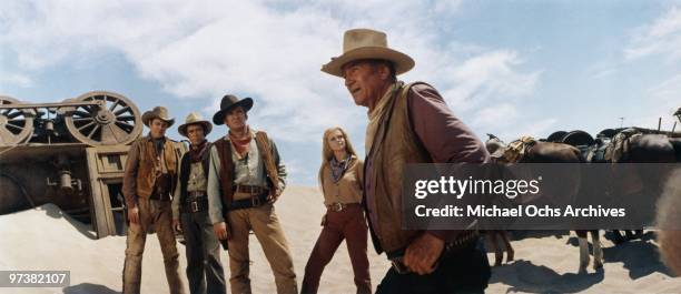 Ben Johnson, Christopher George, Rod Taylor, Ann-Margret and John Wayne on the set of 'The Train Robbers' directed by Burt Kennedy in 1973 in...