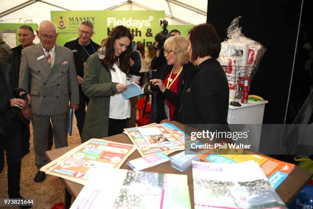 New Zealand Prime Minister Jacinda Ardern looks over the Plunket stall during a walkabout at the Mystery Creek Fieldays on June 14, 2018 in Hamilton,...