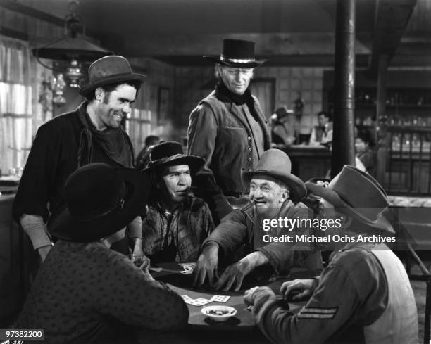 Walter Brennan , John Wayne and Chief Yowlachie on the set of the movie 'Red River' in 1948 in the Whetstone Mountains, Arizona.