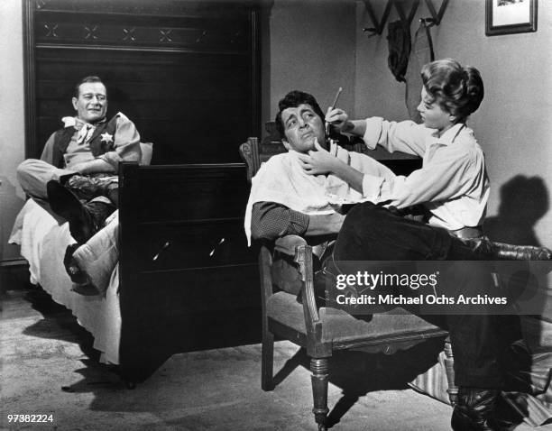 John Wayne, Angie Dickinson and Robert Mitchum on the set of the movie 'Rio Bravo' in 1959 in Tucson, Arizona.