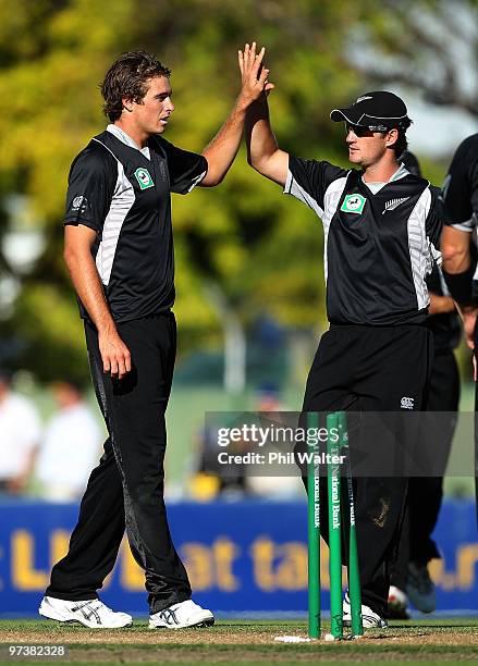 Tim Southee of New Zealand celebrates his wicket of James Hopes of Australia during the First One Day International match between New Zealand and...