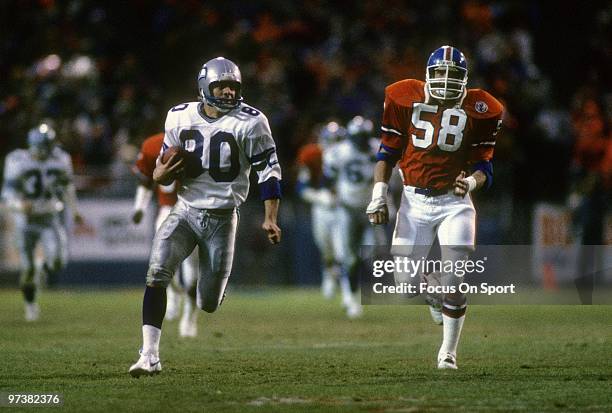 S: Wide Receiver Steve Largent of the Seattle Seahawks in action runs away from linebacker Rob Nairne of the Denver Broncos during an NFL football...