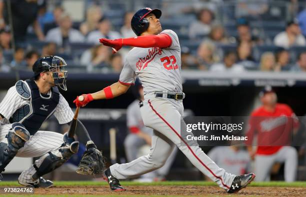 Juan Soto of the Washington Nationals follows through on a fourth inning three run home run against the New York Yankees at Yankee Stadium on June...