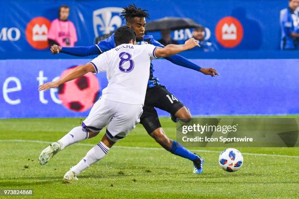 Montreal Impact midfielder Raheem Edwards tries to kick the ball in front of Orlando City SC midfielder Tony Rocha during the Orlando City SC versus...