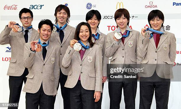 Joji Kato, Daisuke Takahashi, Keiichiro Nagashima, Mao Asada, Maki Tabata, Nao Kodaira and Masako Hozumi pose for photographs during the Japanese...