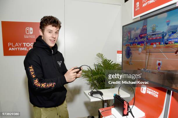 Nolan Gould stopped by the Nintendo booth at the 2018 E3 Gaming Convention for some hands-on time with the Mario Tennis Aces game for the Nintendo...