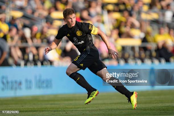Columbus Crew SC midfielder Will Trapp watches for a defender as he sprints for the ball in the MLS regular season game between the Columbus Crew SC...