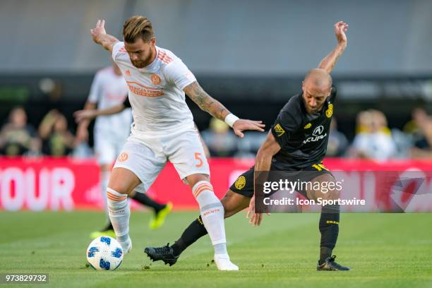 Atlanta United FC defender Leandro Gonzalez Pirez and Columbus Crew SC midfielder Federico Higuain battle in the MLS regular season game between the...