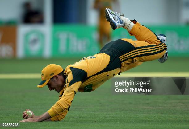 Michael Hussey of Australia takes a catch to dismiss Peter Ingram of New Zealand during the First One Day International match between New Zealand and...