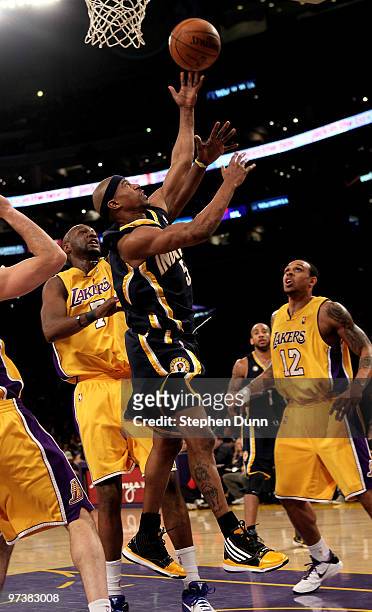 Ford of the Indiana Pacers shoots over Lamar Odom of the Los Angeles Lakers on March 2, 2010 at Staples Center in Los Angeles, California. The Lakers...