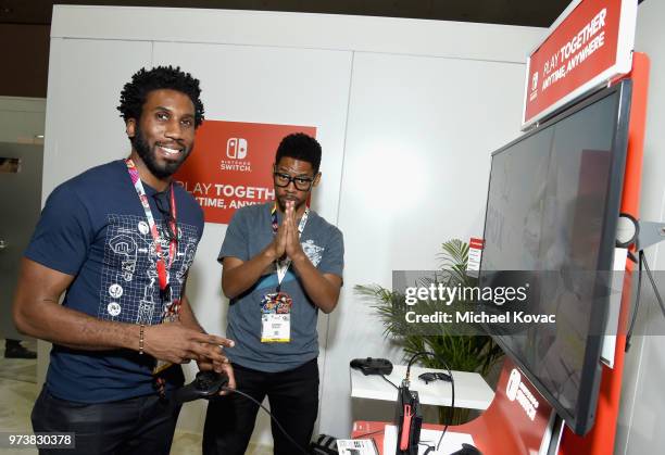 Nyambi Nyambi and Alphonso McAuley visit the Nintendo booth during the 2018 E3 Gaming Convention at Los Angeles Convention Center on June 13, 2018 in...